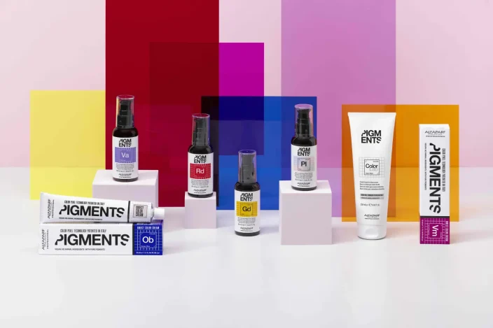 ALFAPARF Milano Professional's PIGMENTS Direct Colour System products on a colourful background.