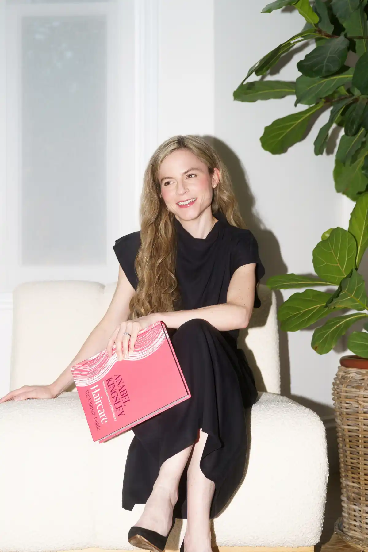 Anabel Kingsley sits with her book.