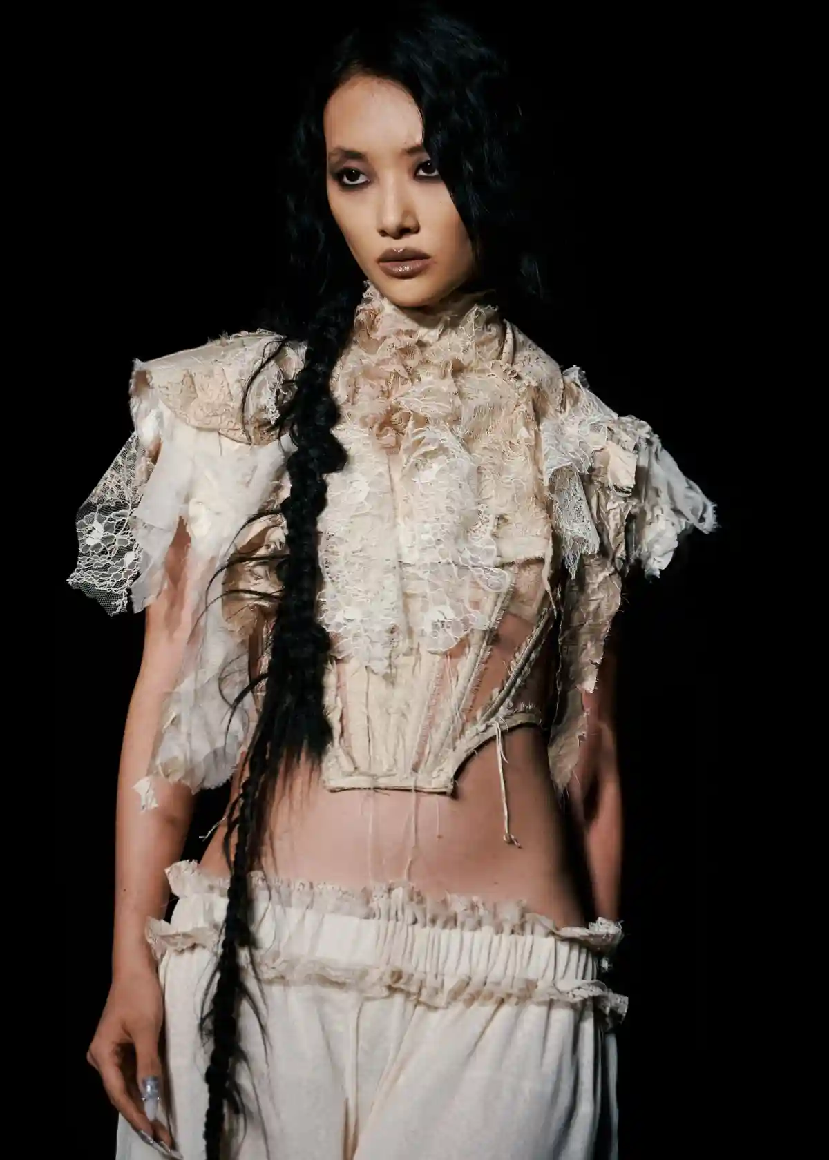 Model with long side braid at LFW DREAMING ELI SS27.