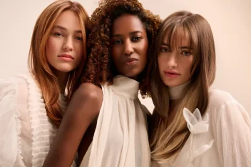 Three models with Golden Hour highlights by Aveda.