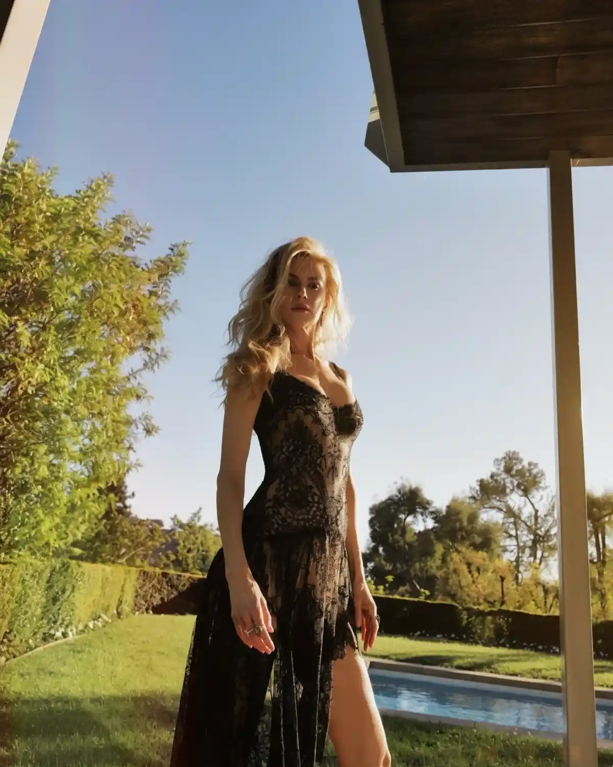 Nicole Kidman in the centre with blonde hair and a black dress.