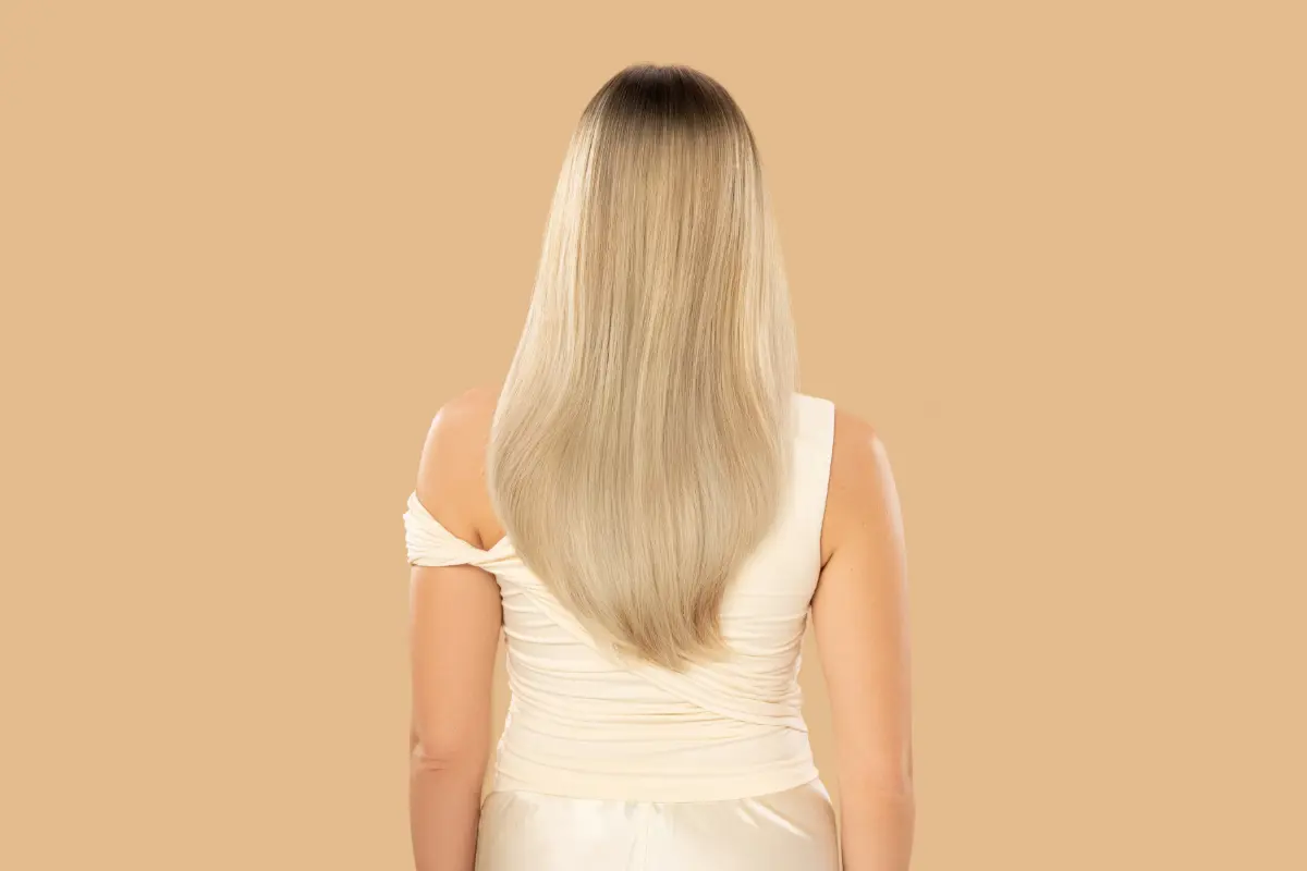 JOICO LumiShine Demi Liquid on a blonde model.