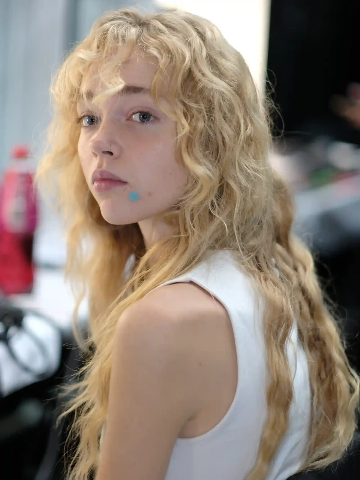 Model has her hair done backstage at Erdem SS27.