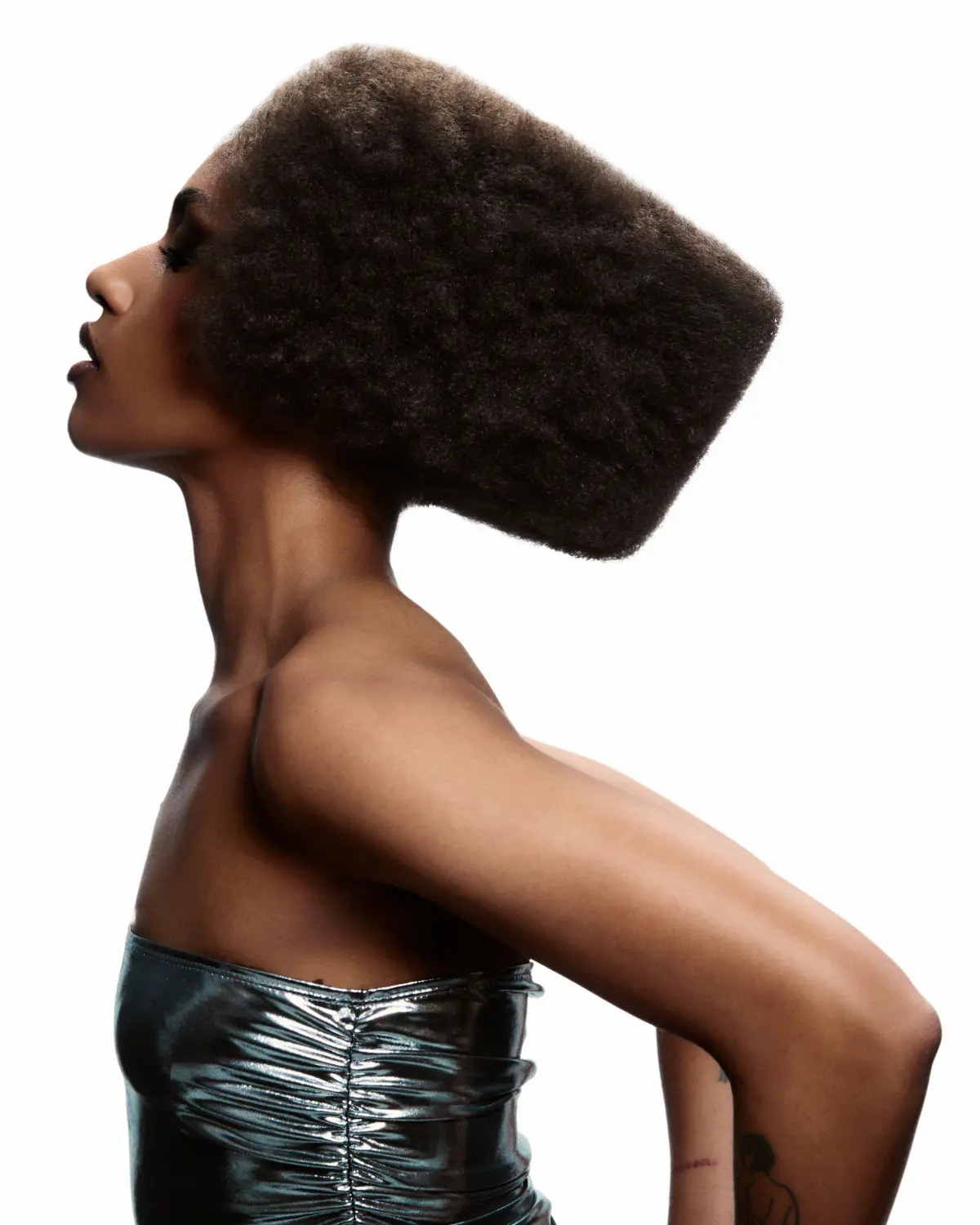 Chris Grimley’s Motion collection featuring a sculptural afro hairstyle with geometric shape, volume and modern movement.
