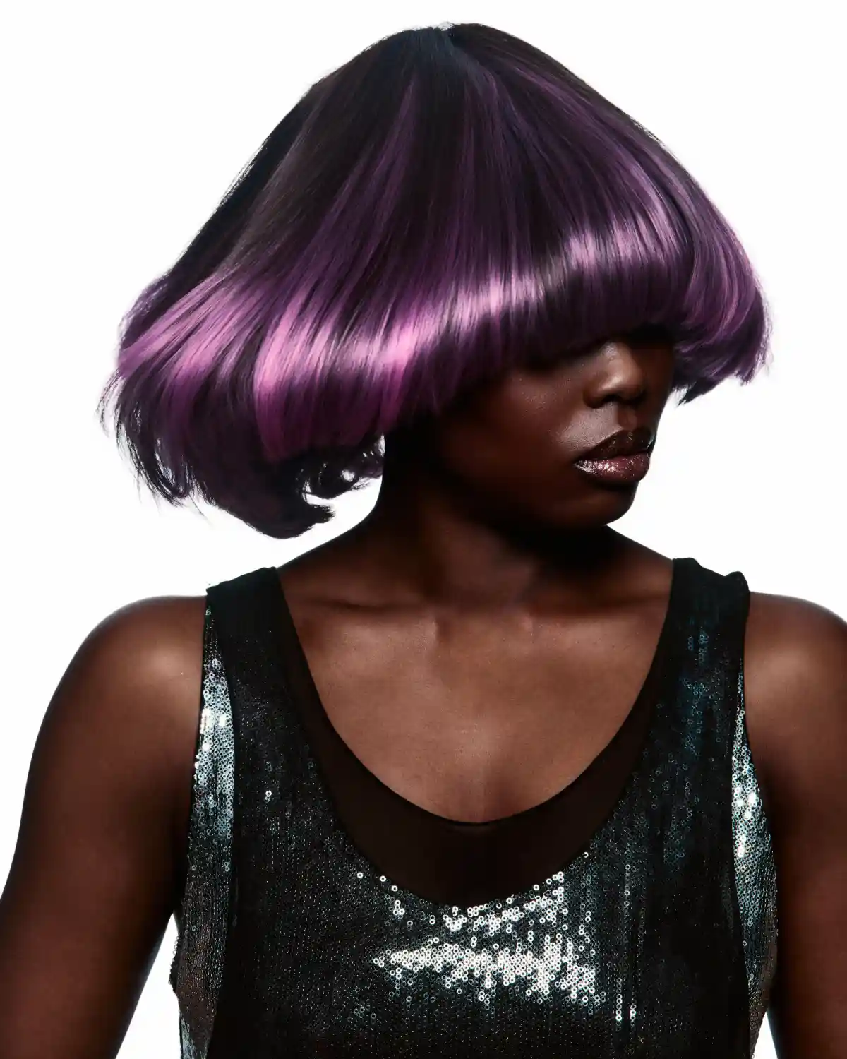 Chris Grimley’s Motion collection featuring a sleek purple bob with full fringe, sculpted shape and glossy, polished texture.