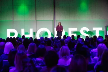 Speaker stands on the stage at the Phorest Salon Summit.