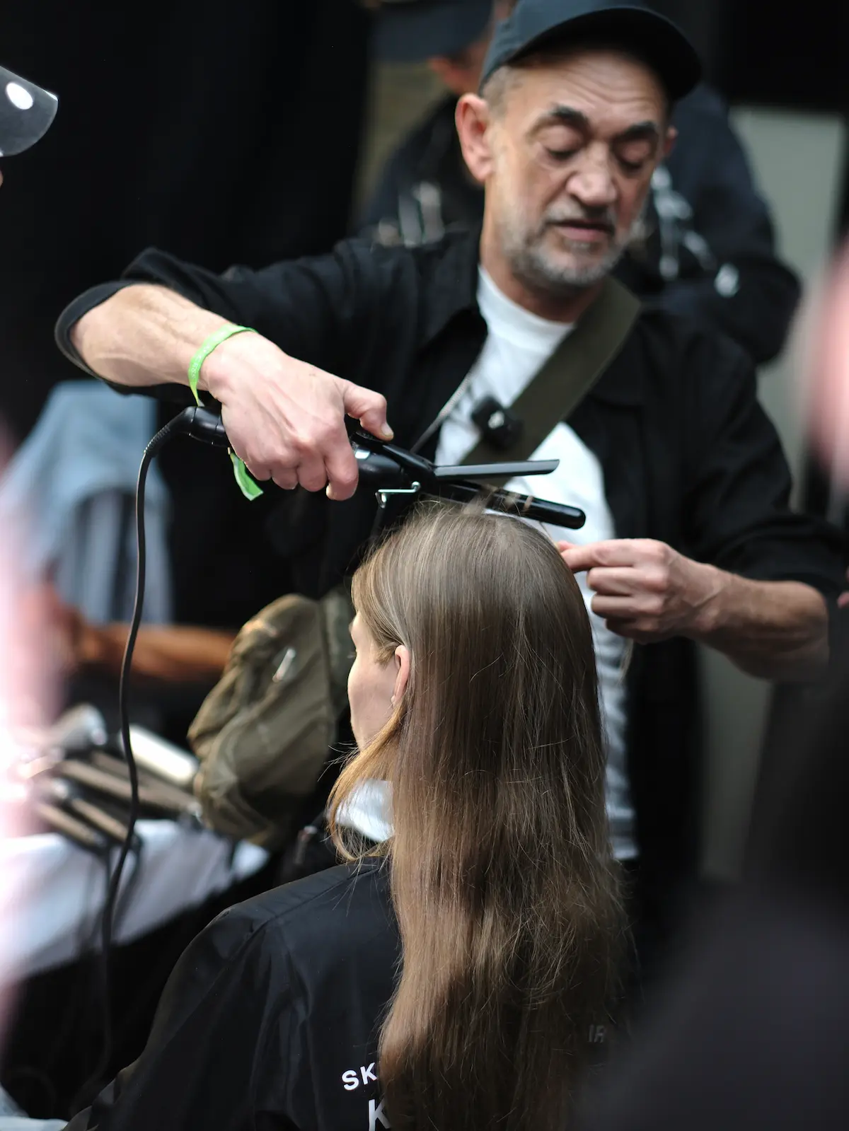 Eugene Souleiman creating the hair with Kevin.Murphy backstage at LFW SS27.