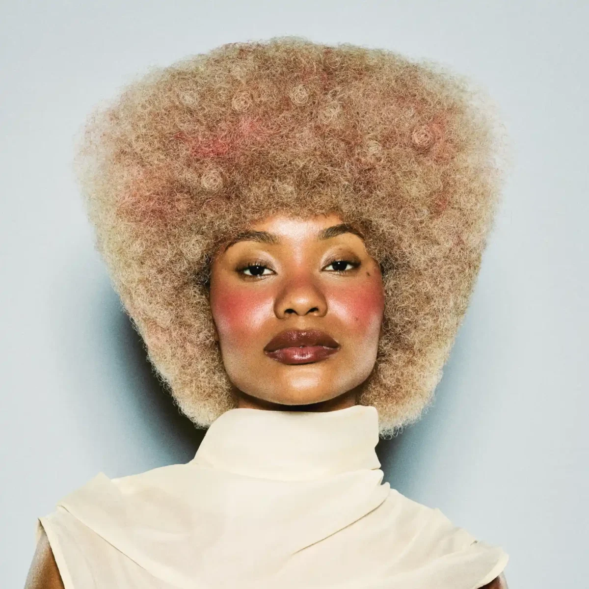 Model with short curly blonde hair part of the Weight We Wear collection by Elle Foreman.