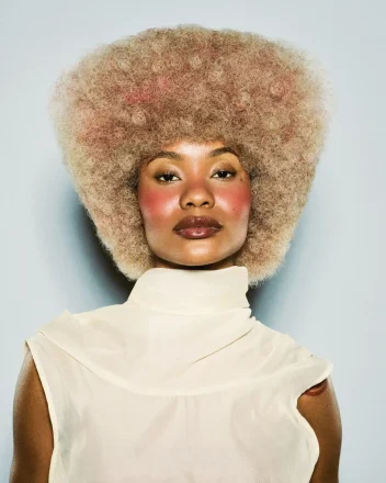 Model with short curly blonde hair part of the Weight We Wear collection by Elle Foreman.