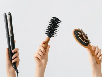 Hands holding hair tools.