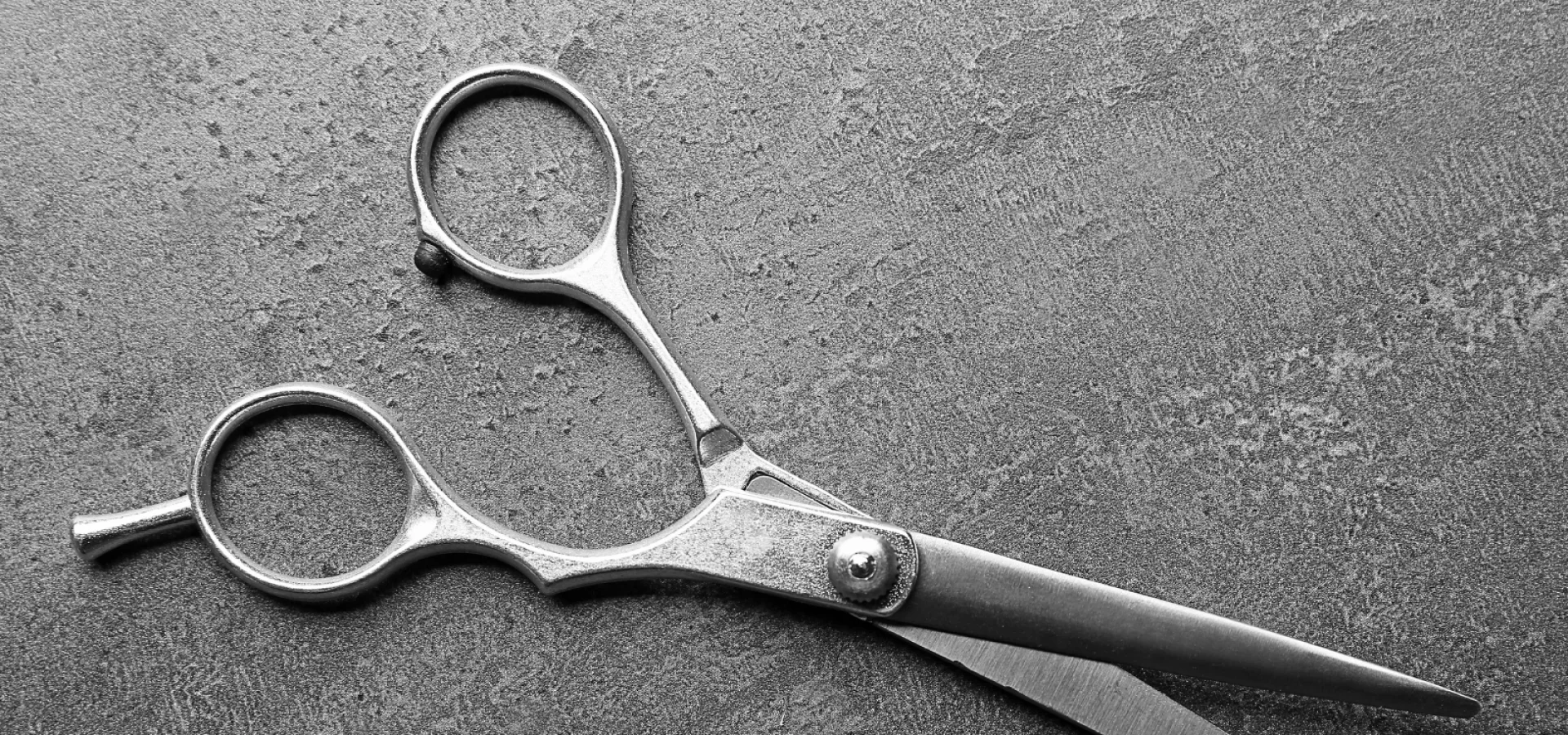 scissors on a concrete background