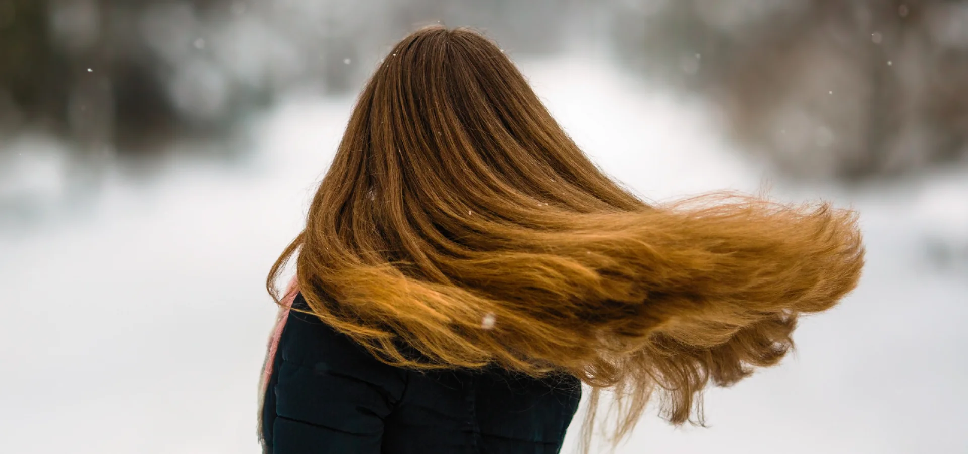 Model with long hair in winter weather.