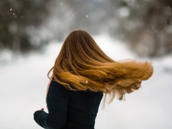 Model with long hair in winter weather.