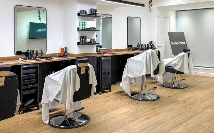 Salon chairs by mirrors in Bailey Snowden's salon.