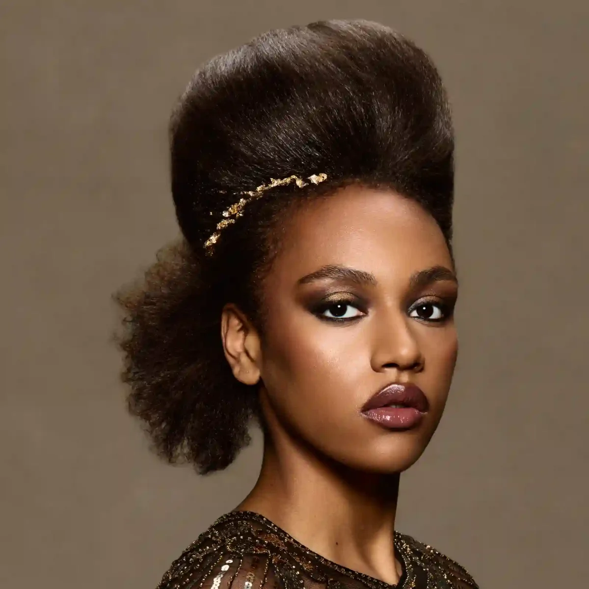 Afro-textured sculptural updo with gold adornment from Chris Grimley’s Future Ancestry collection.