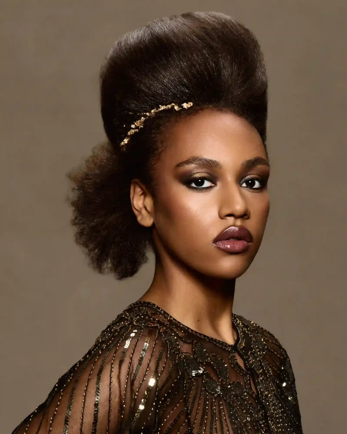 Afro-textured sculptural updo with gold adornment from Chris Grimley’s Future Ancestry collection.