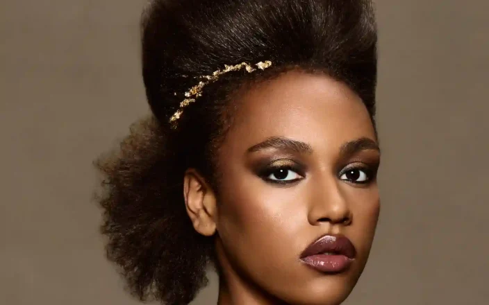 Afro-textured sculptural updo with gold adornment from Chris Grimley’s Future Ancestry collection.