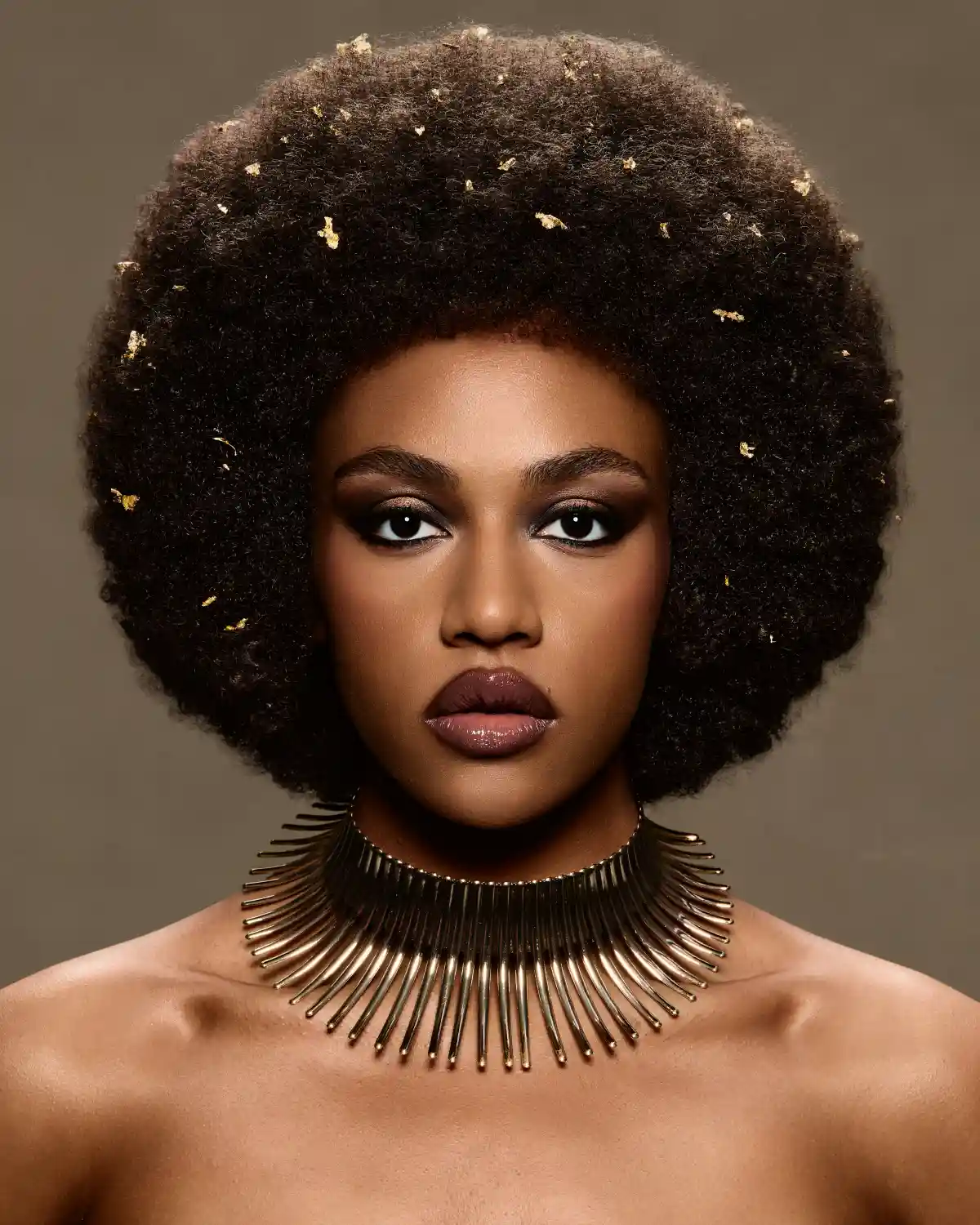 Afro-textured natural afro with gold accents from Chris Grimley’s Future Ancestry collection.