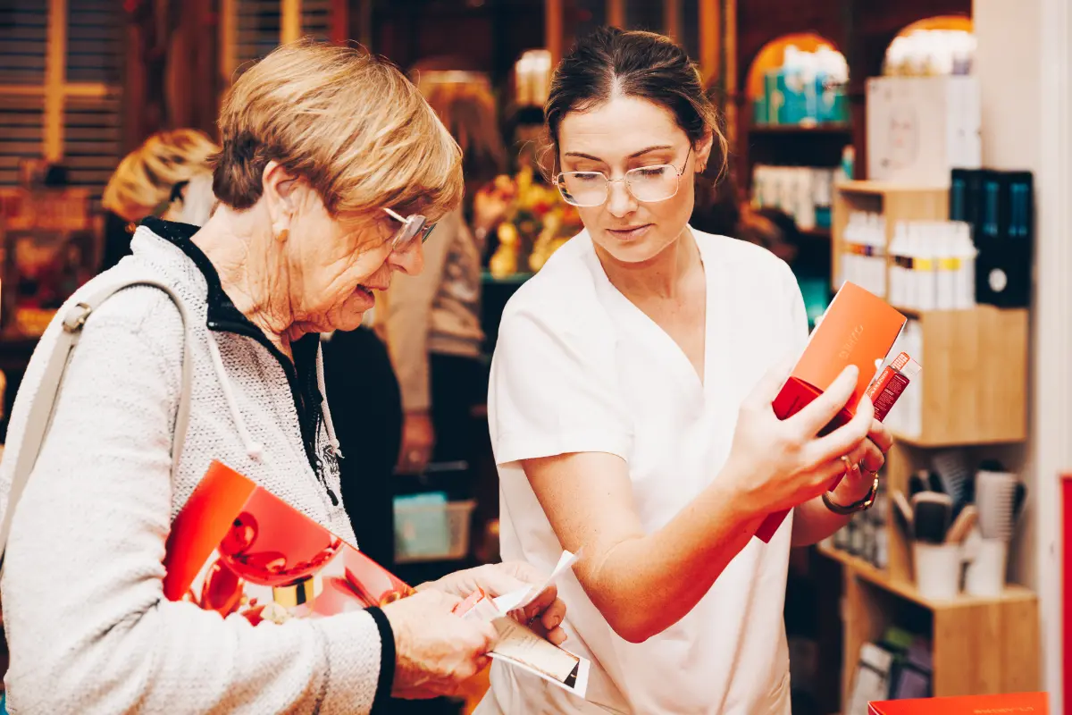Sales Assistant talks a customer through some products.