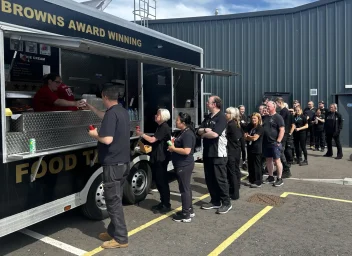 Staff at a fish and chips van at Denman headquarters