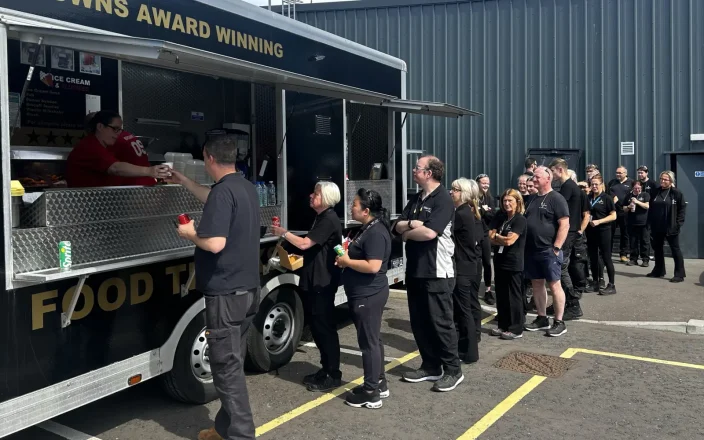 Staff at a fish and chips van at Denman headquarters