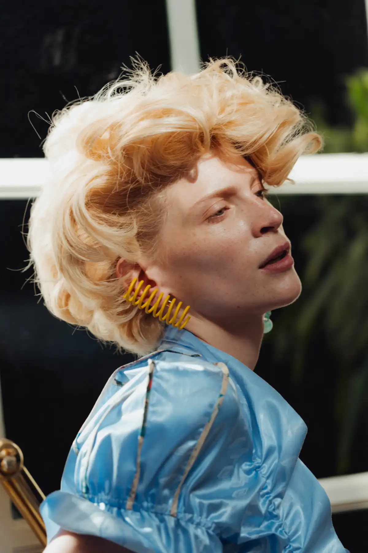 Model with short curly hair at PFW SS27 Vivienne Westwood.