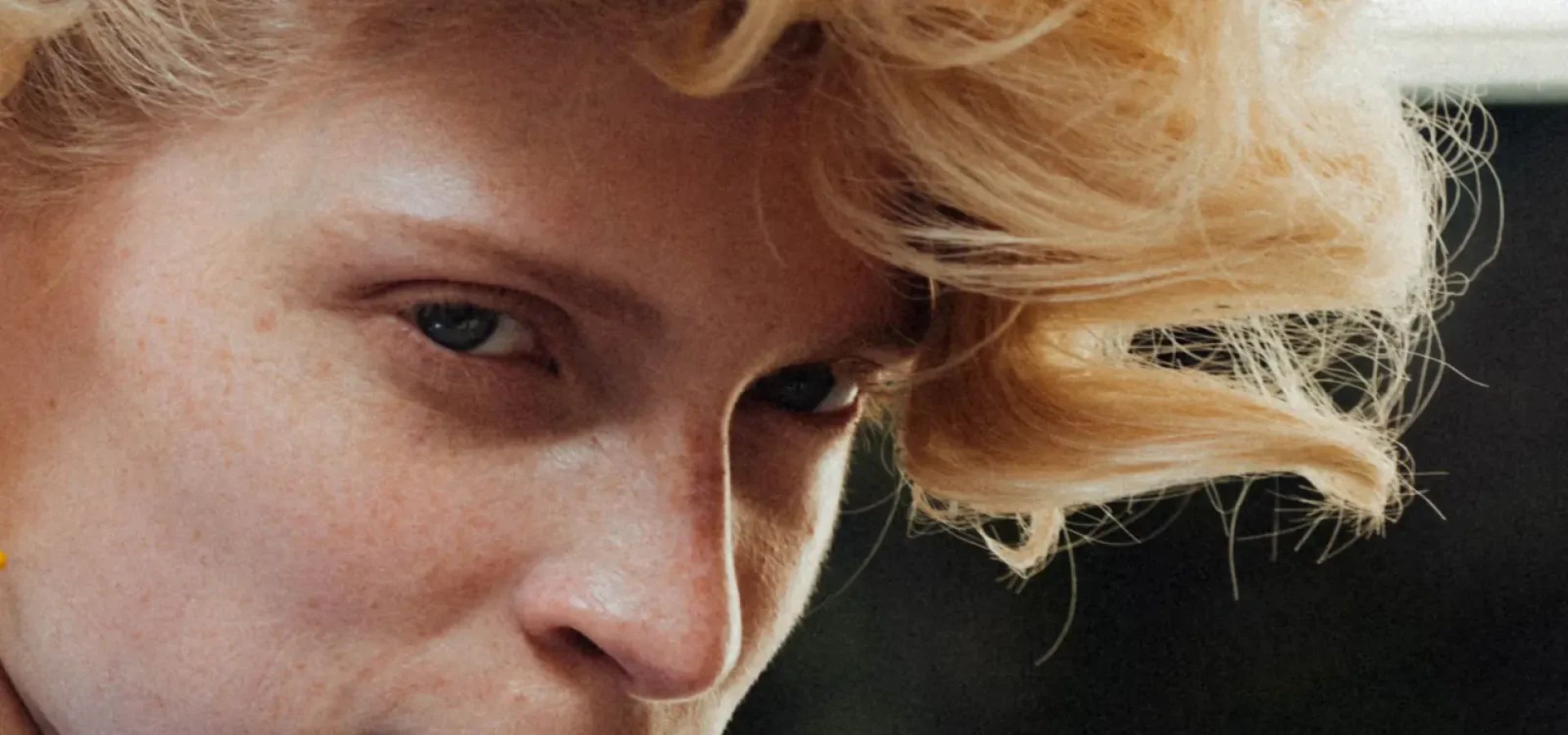 Close up of model with short curl hair at PFW SS27 Vivienne Westwood.
