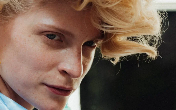 Close up of model with short curl hair at PFW SS27 Vivienne Westwood.