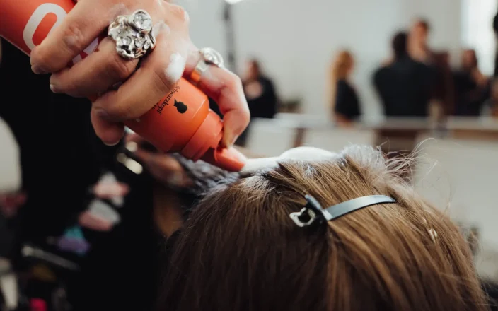 Close up of SKP product being used backstage at PFW SS27 Ann Demeulemeester
