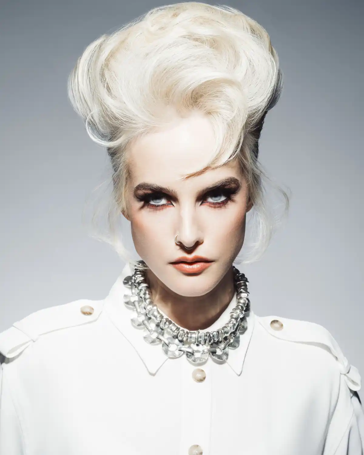 Platinum blonde sculptural updo from Rainbow Room George Square’s Rebellion collection, inspired by 70s punk and David Bowie.