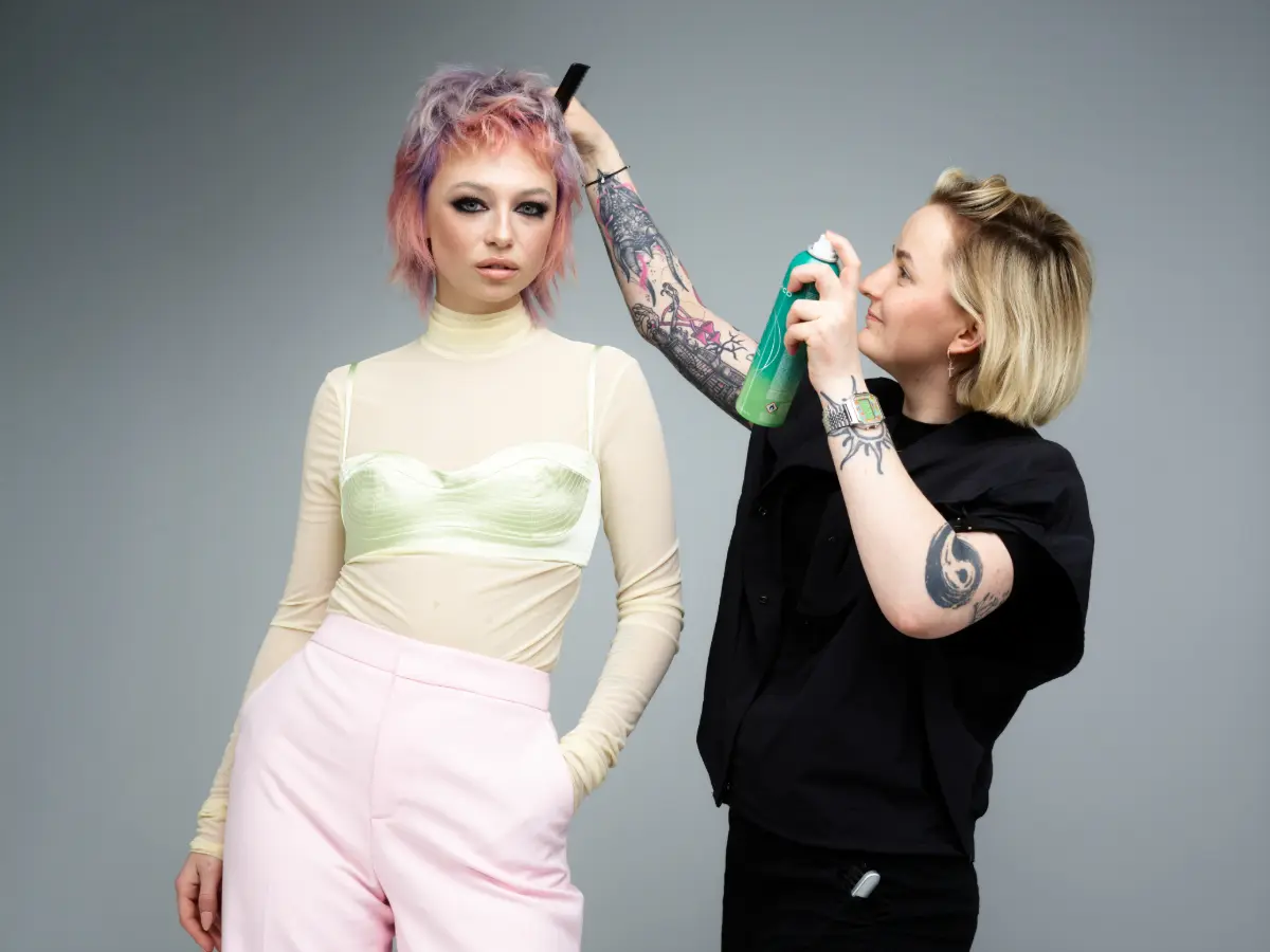 JOICO Colour Award winner 2025 styles a model's hair.