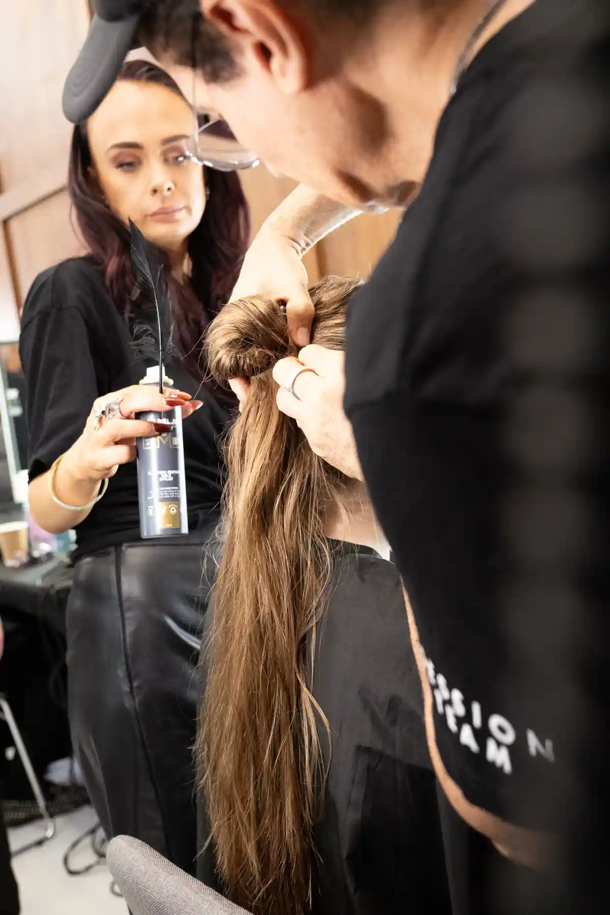 Model getting hair done backstage at TONI&GUY X John Richmond SS27