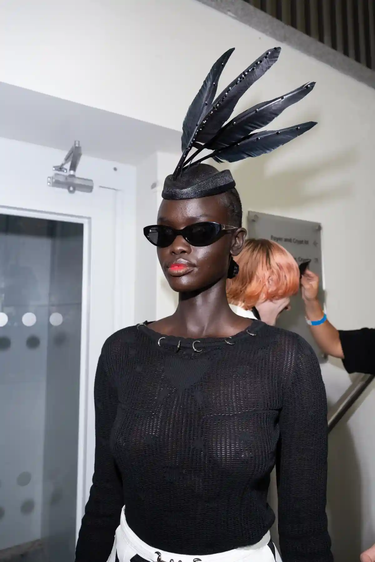 Model with feathers in hair at TONI&GUY X John Richmond SS27