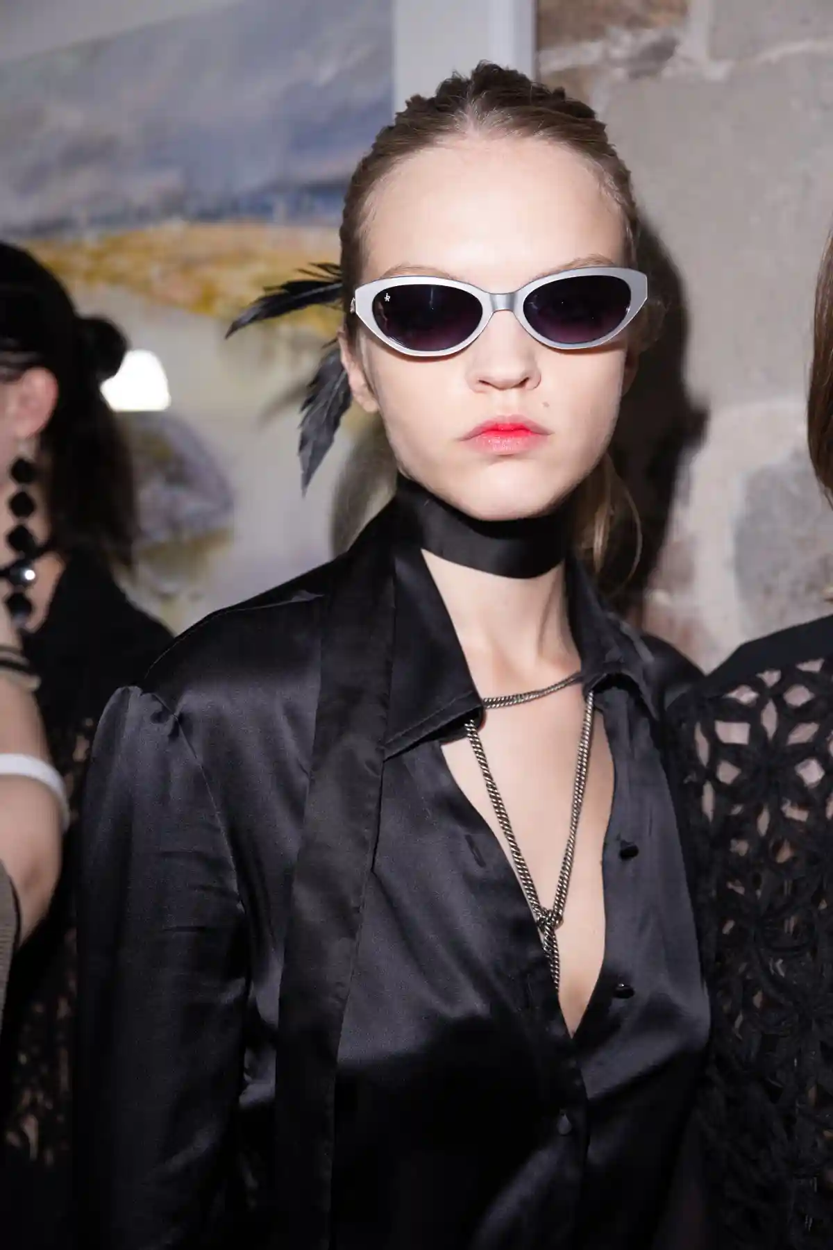 Model with feather and sunglasses at TONI&GUY X John Richmond SS27