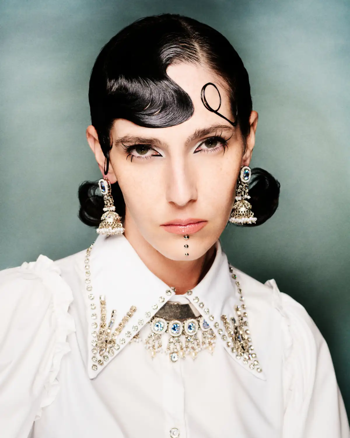 Model with black hair with a finger fringe from the Morphion Collection by Let Lew.