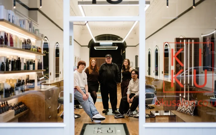 Staff from KIKU salon inside the salon as photo is taken from the buildings entrance.