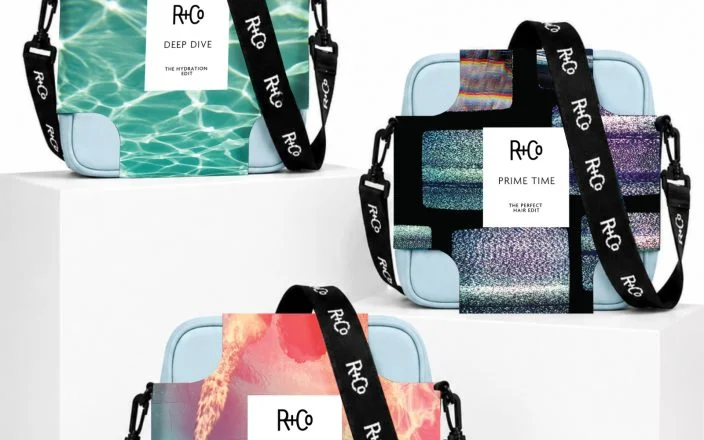 Three R+Co holiday gift sets; crossbody bags with product inside.