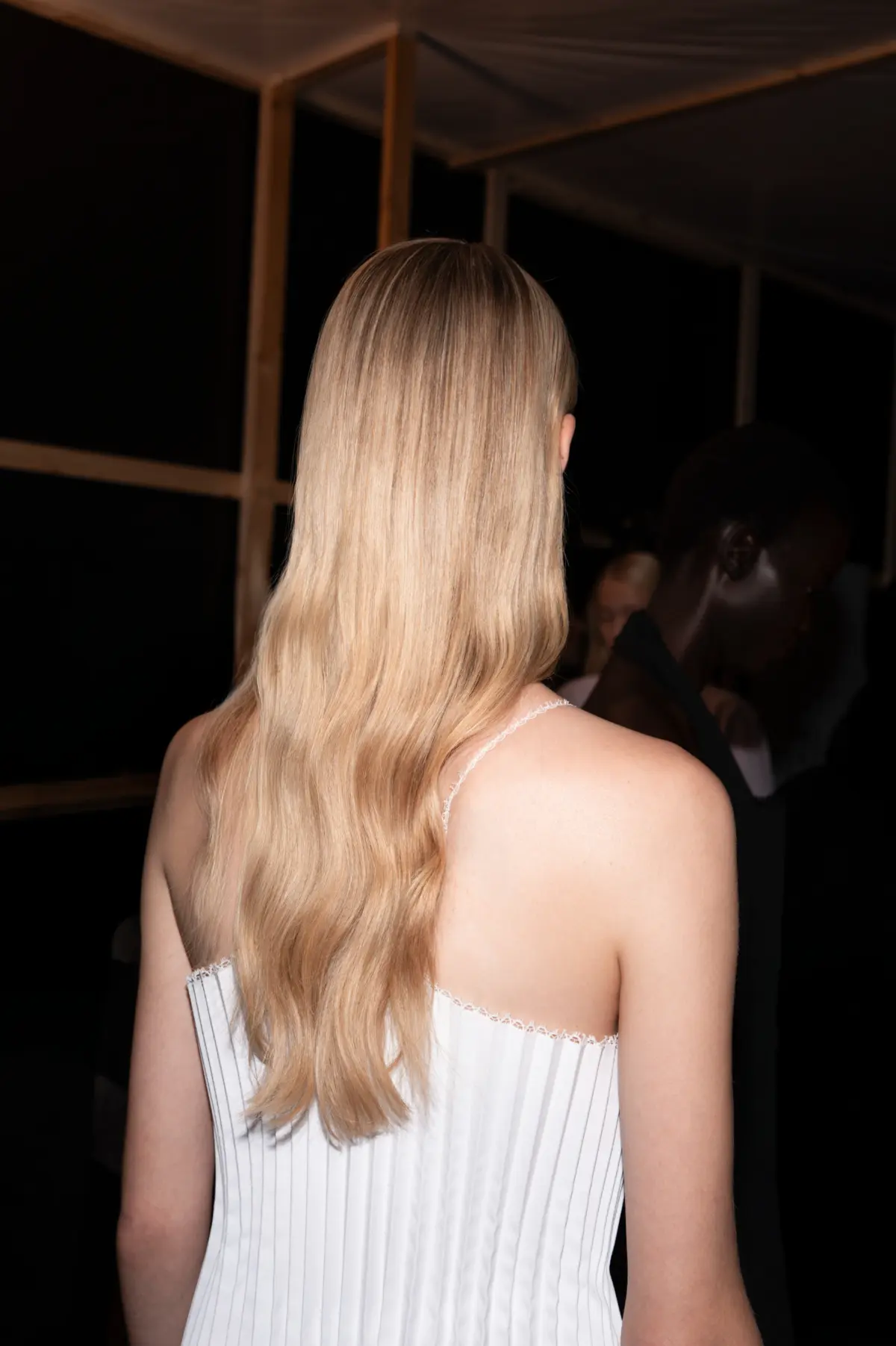 Model with long blonde hair at Victoria Beckham's PFW SS27 show.