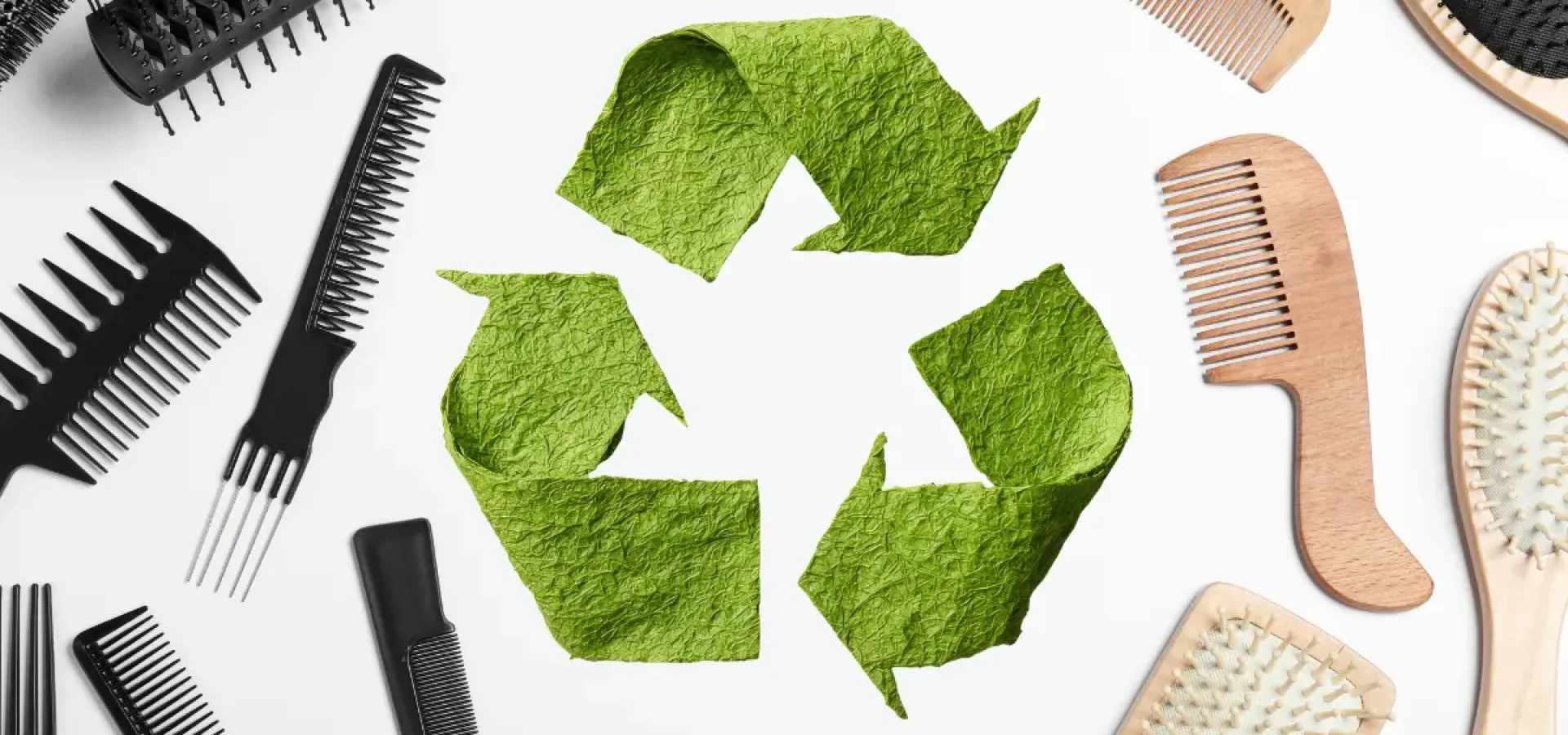 Hair tools with a recycle symbol in the centre.