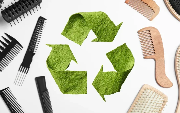 Hair tools with a recycle symbol in the centre.